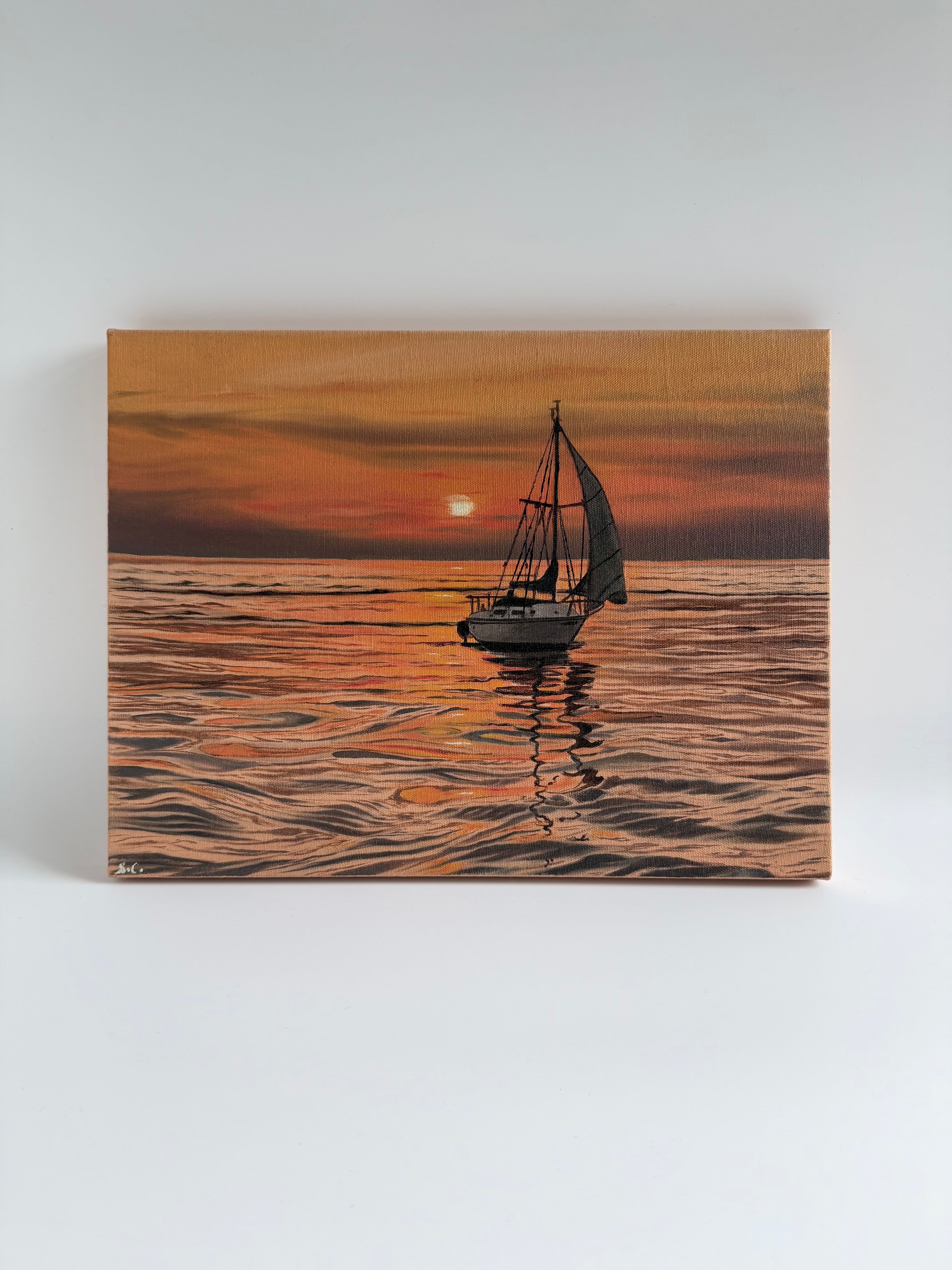 Original sailboat sunset oil painting featuring a peaceful lake and glowing evening sky.