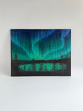 Original Aurora Borealis oil painting featuring vibrant Northern Lights reflected over a peaceful lake landscape.