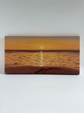 Original panoramic beach sunset oil painting featuring glowing golden reflections across calm ocean waters.