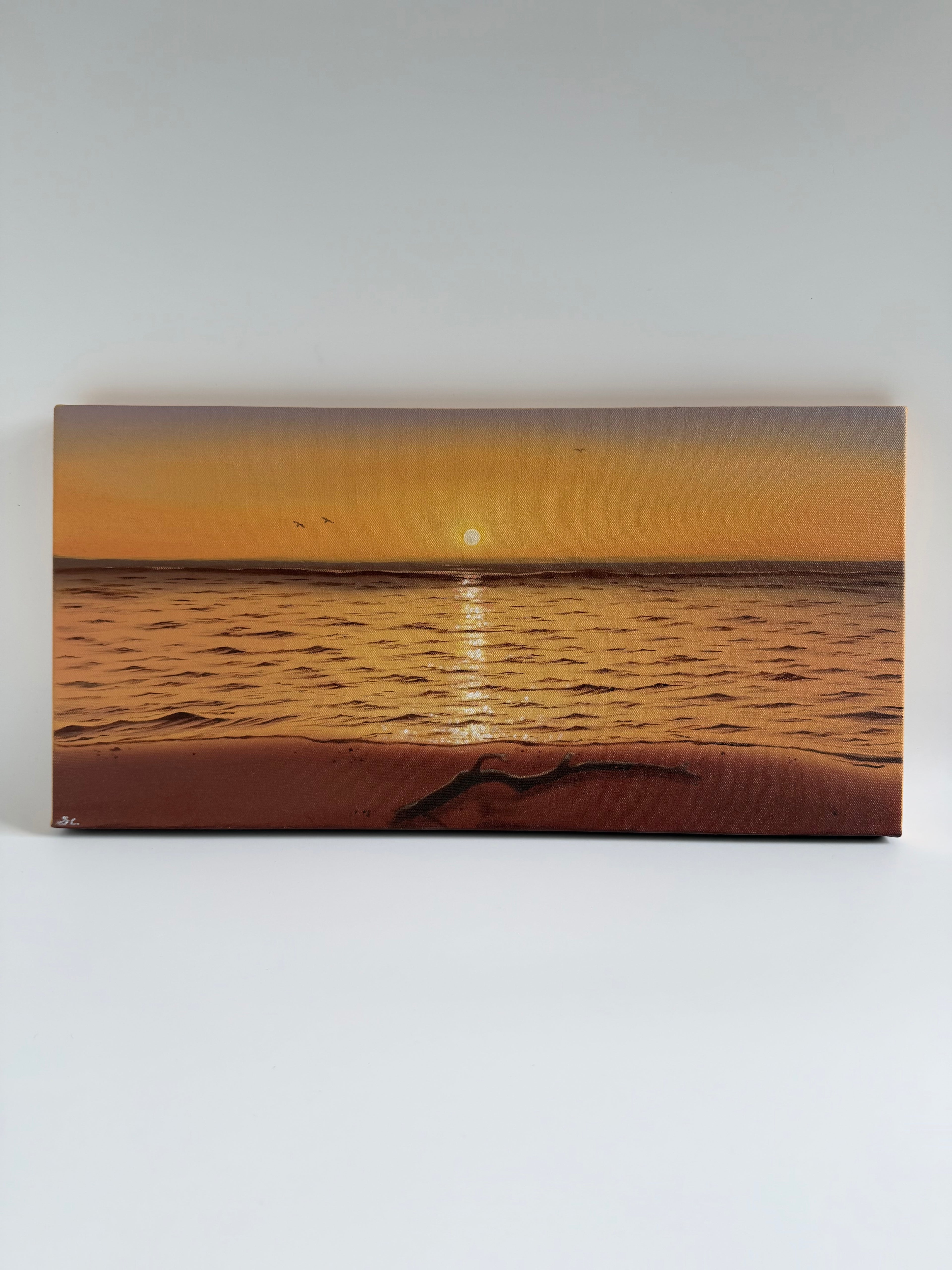Original panoramic beach sunset oil painting featuring glowing golden reflections across calm ocean waters.